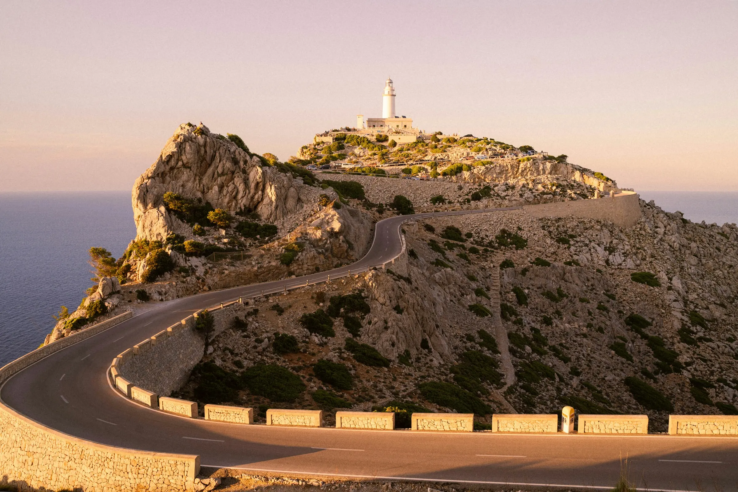The winding coastal road to the Cap de Formentor lighthouse at sunset, Mallorca
